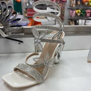 White heels with silver jewelry